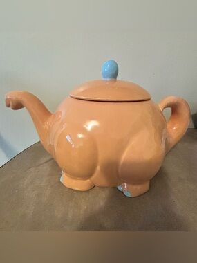 Vintage collectible dinosaur-shaped ceramic teapot. whimsical